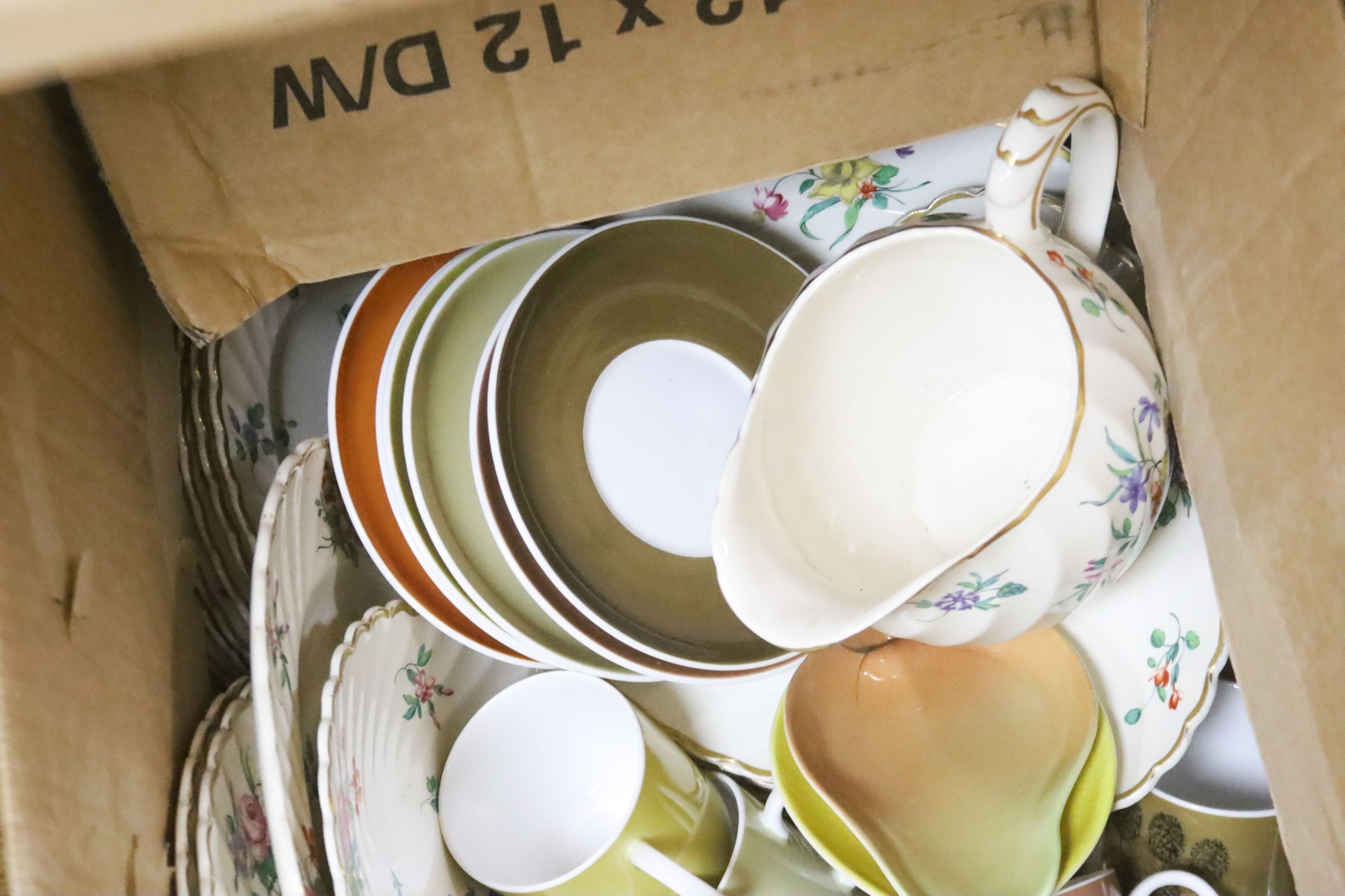 Two part teasets, Susie Cooper and Clarice Cliff, printed